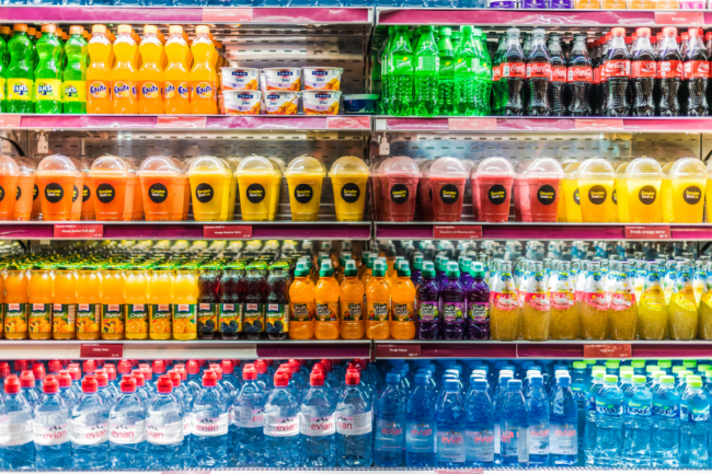 Bottles beverages on grocery store shelf