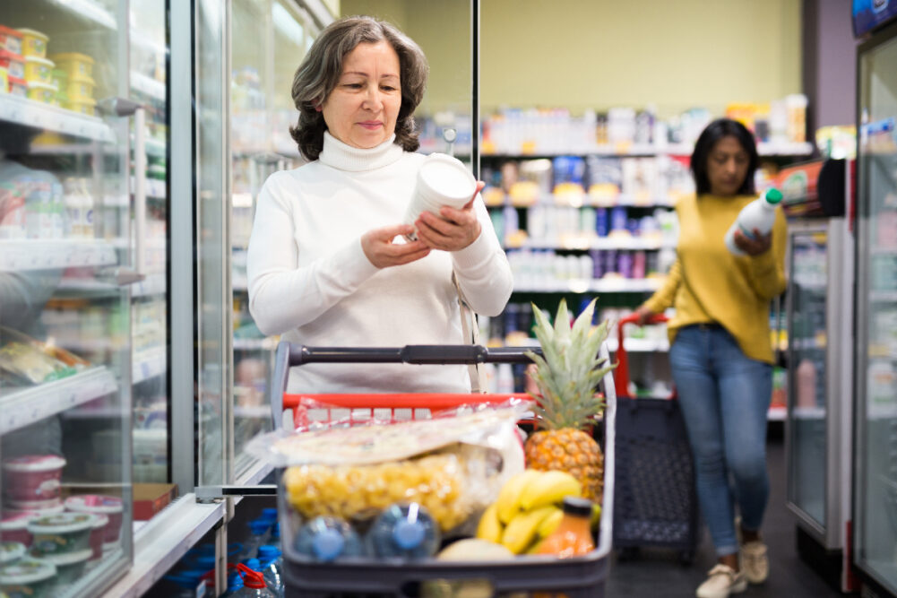 shopping consumers dairy aisle products grocery store freezer